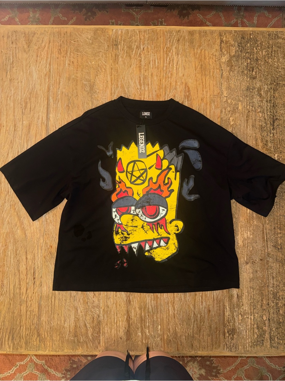 Black Short-Sleeve Graphic Tee with Yellow Flame Character